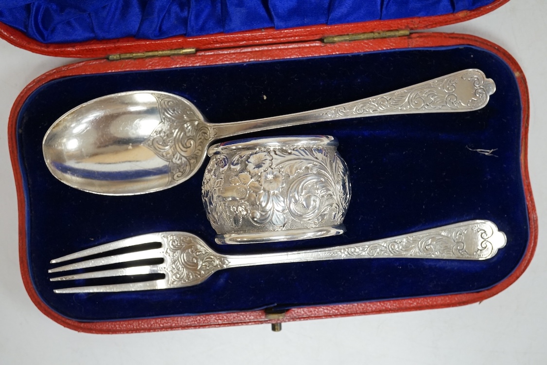 Three assorted silver christening sets including spoon, fork and napkin ring by William Hutton & Sons, London, 1896, one other set with steel knife, two cased sets of silver coffee spoons and a cased set of six Japanese